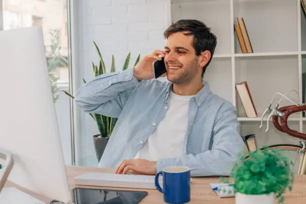 Smiling matchmaking expert talking on the phone, ready to help singles connect through personalized dating services in Alexandria, VA